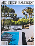 Architectural Digest cover showing a swimming pool in a tropical setting.